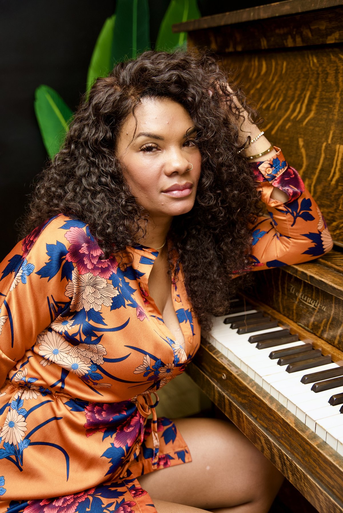 Studio portrait at vintage piano
