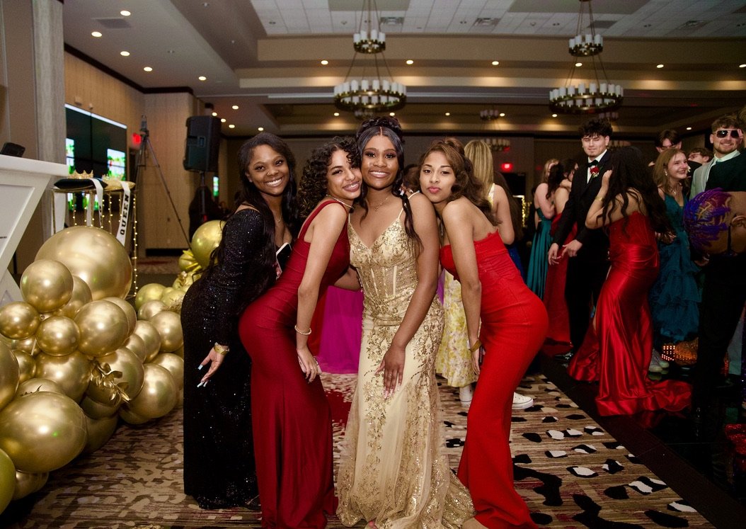 Prom group with gold balloons